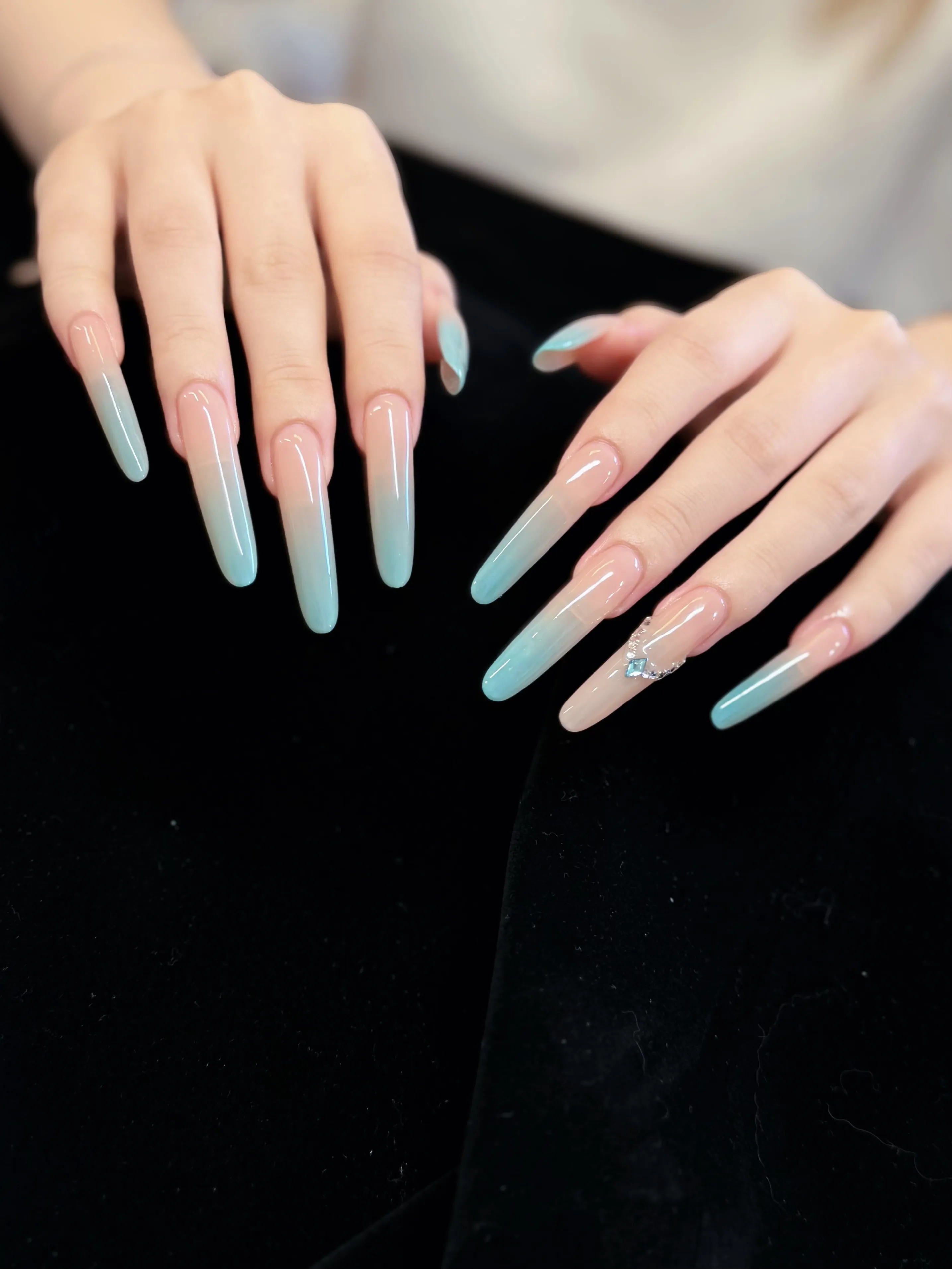 Glossy pink-to-aqua ombré coffin Gel-X with a rhinestone accent by Bella at L2 Nail Salon Mountain View