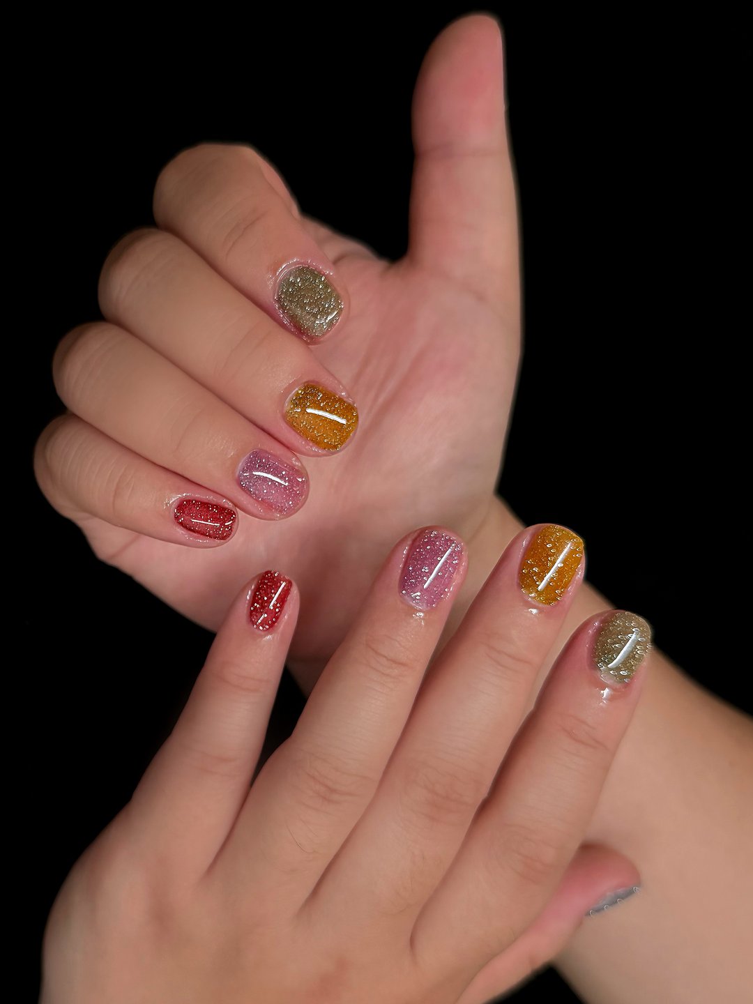 Jelly glitter Gel-X in amber, ruby and gold at L2 Nail Salon Mountain View