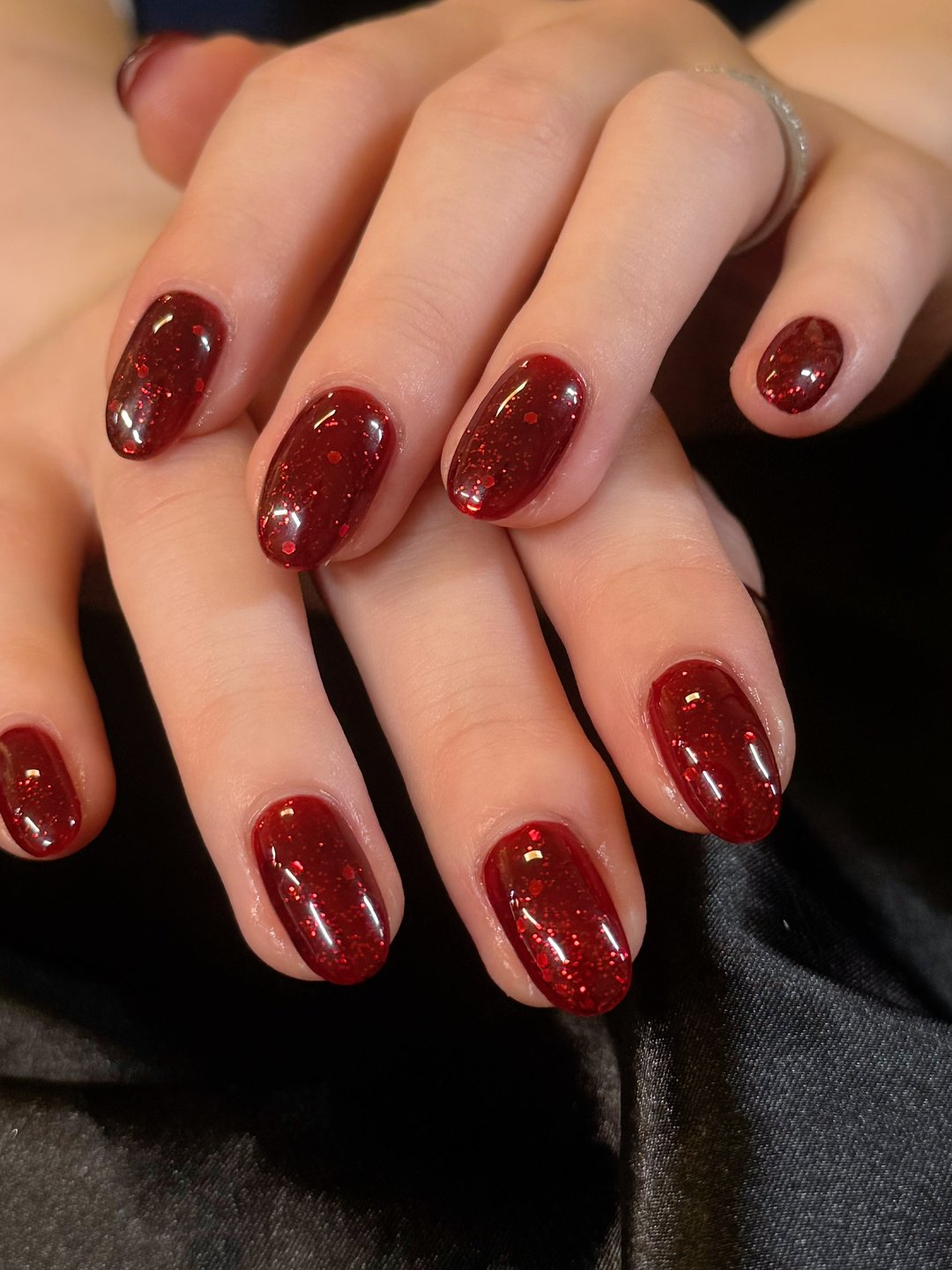 Glossy ruby red Gel-X manicure at L2 Nail Salon Mountain View