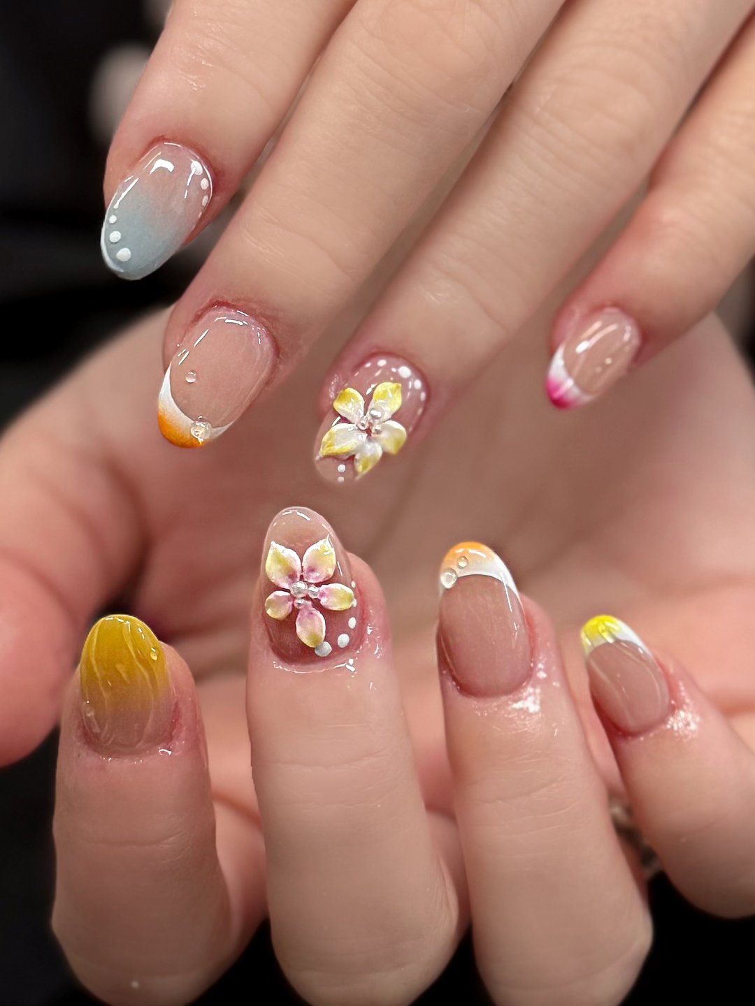 Pastel almond Gel-X with floral charms and hand-painted accents at L2 Nail Salon Mountain View