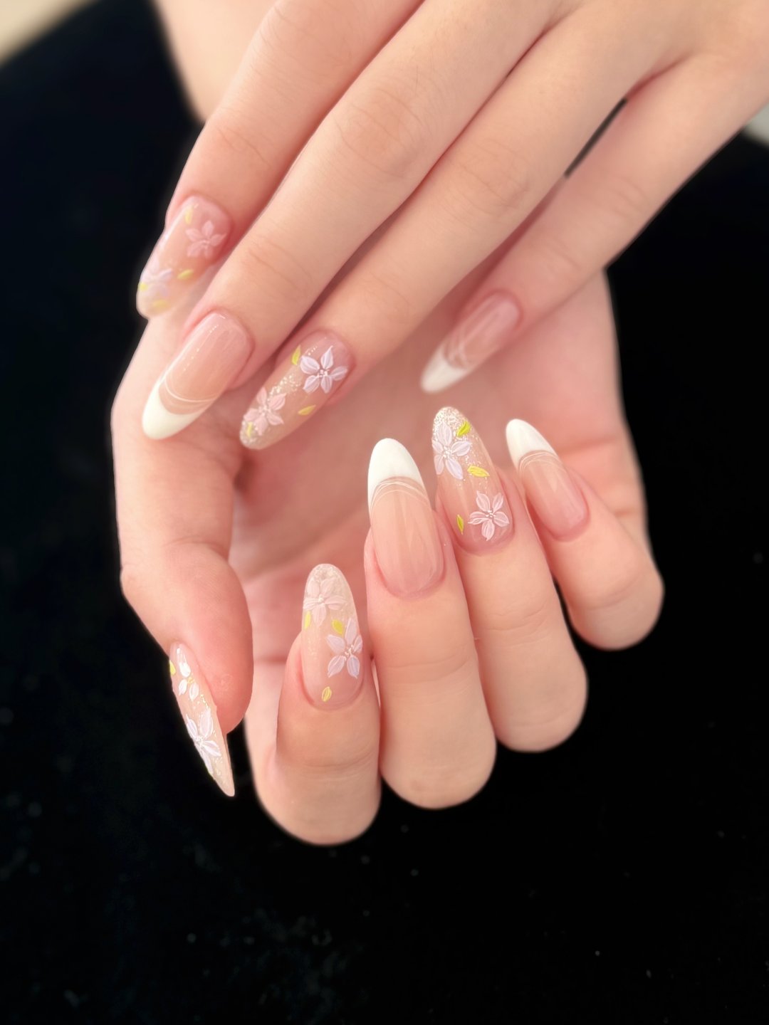 Almond French Gel-X with pressed-flower charms at L2 Nail Salon Mountain View