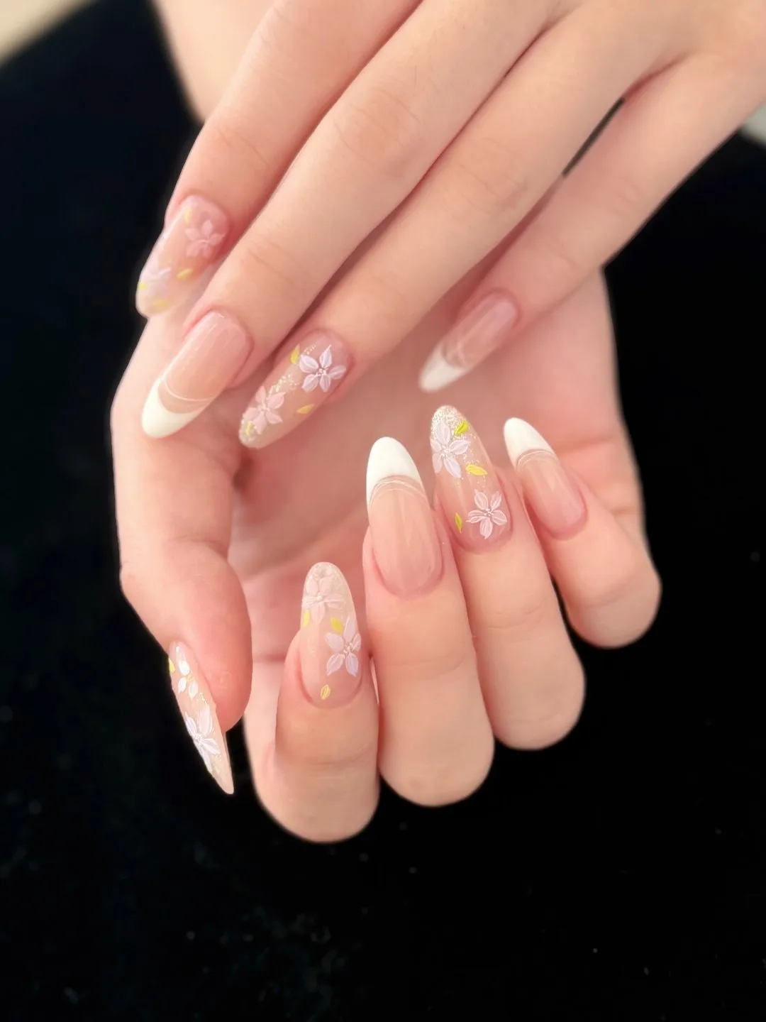 Almond French Gel-X with pressed-flower charms at L2 Nail Salon Mountain View