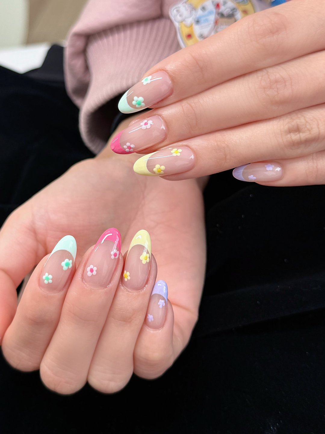 Pastel almond Gel-X with hand-painted flowers and charms at L2 Nail Salon Mountain View