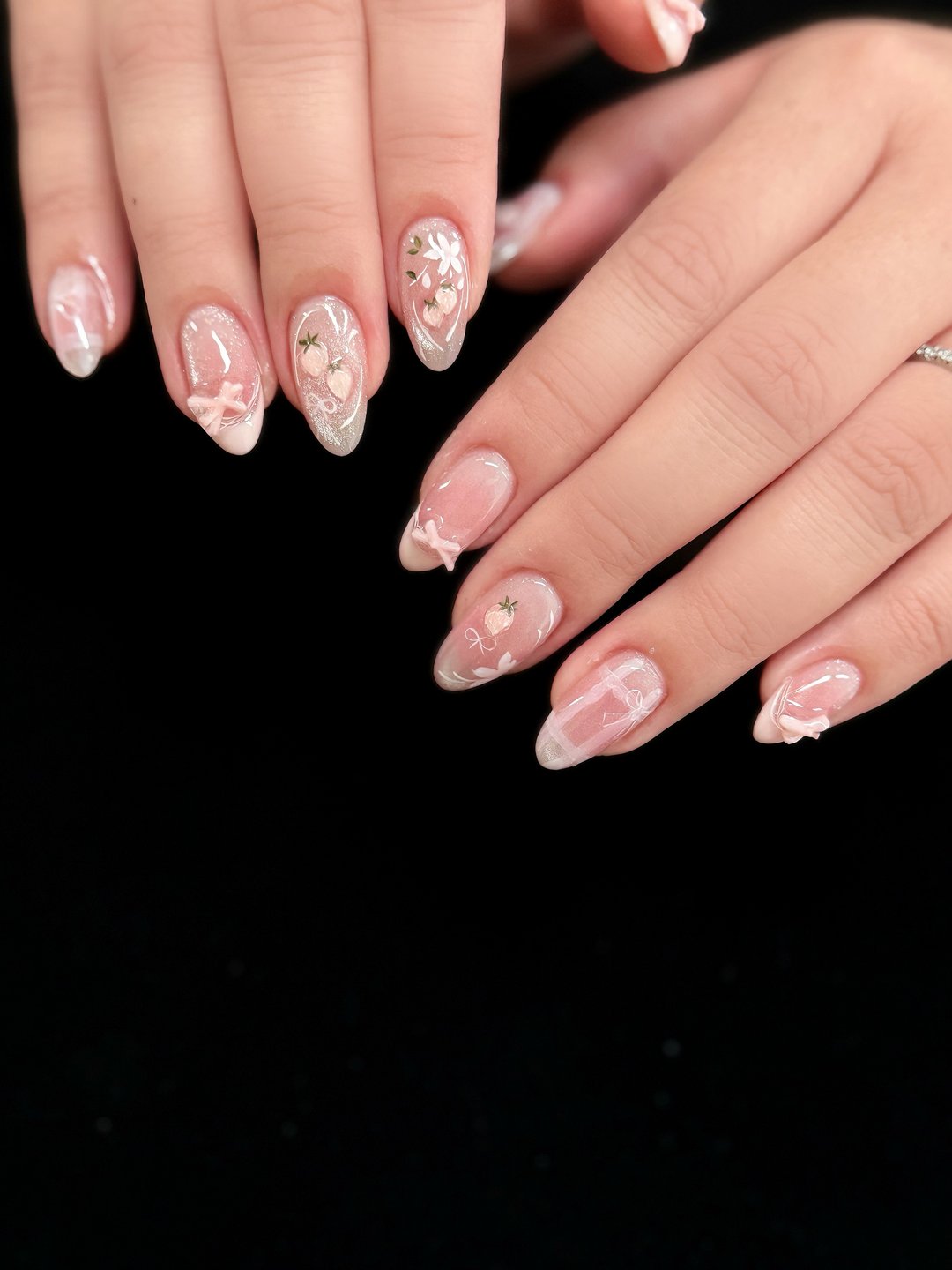 Milky white Gel-X with pressed-flower charms at L2 Nail Salon Mountain View