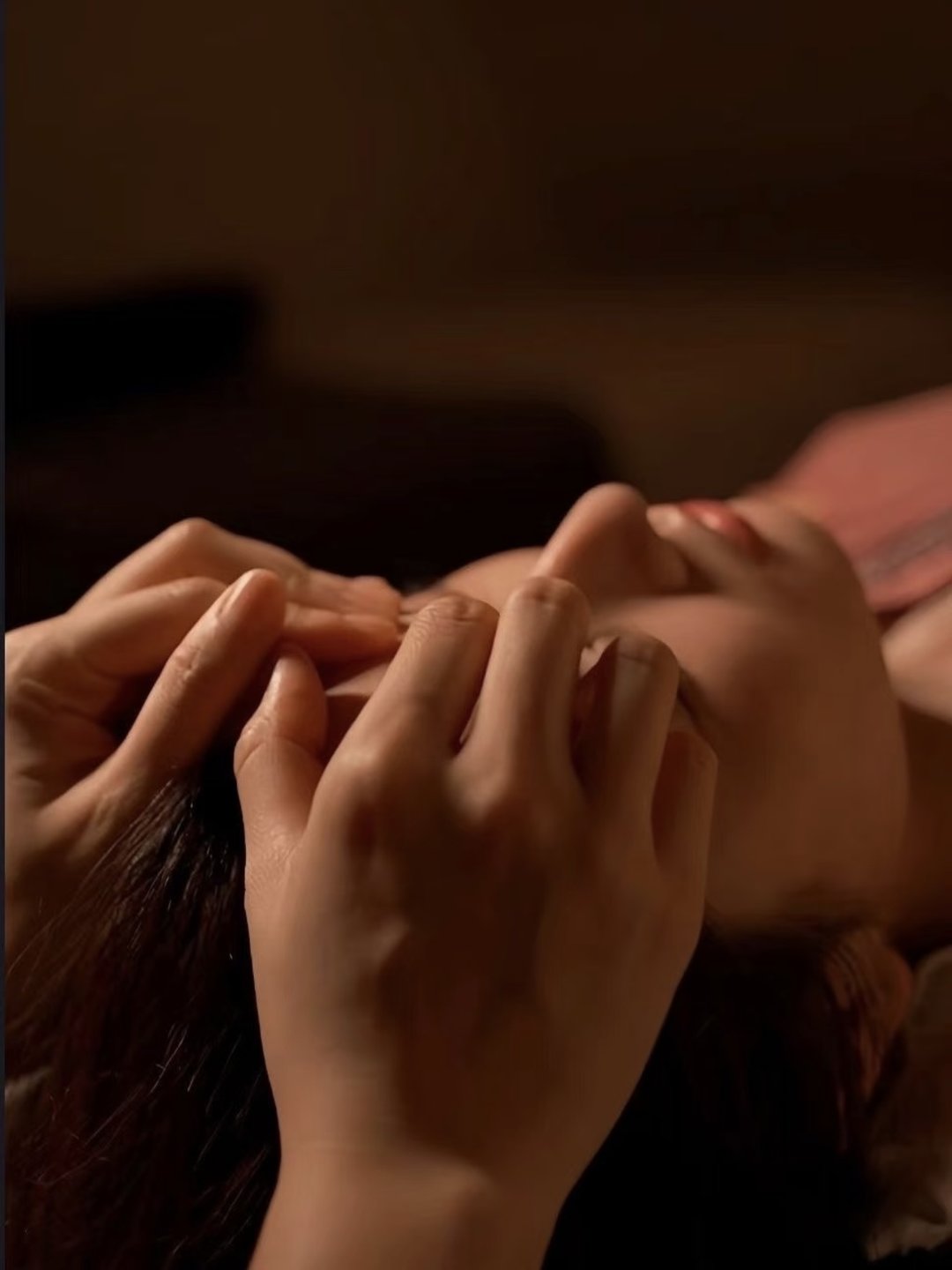 Close-up of therapist's hands giving a scalp massage at Pure Hair Spa Mountain View